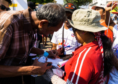 Supporter signing the support form.