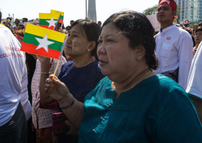 Supporters with the national flag of Myanmar